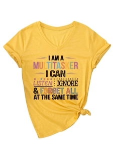 Detail of V-neck yellow cotton T-shirt featuring funny multitasker slogan and front hem knot
