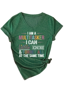 Detail of dark green V-neck T-shirt with 'I AM A MULTITASKER' slogan and knotted side hem