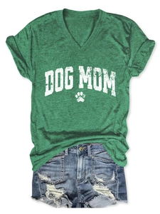 Detail of V-neck dark green T-shirt featuring white Dog Mom lettering and paw print graphic