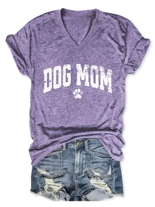 Flat lay of purple V-neck T-shirt with Dog Mom print and distressed denim shorts
