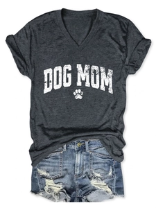 Flat lay of Dog Mom V-neck tee with rolled sleeves and distressed denim shorts