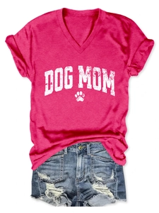Detail of rose red V-neck T-shirt with Dog Mom print and distressed denim shorts