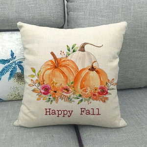Dettaglio federa in lino con stampa zucca Happy Fall su un divano in tessuto grigio