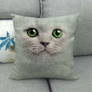 Square linen pillowcase with realistic cat face print and green eyes on grey sofa