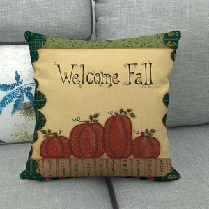 Detail of linen pillowcase with Welcome Fall text and hand-painted pumpkin design
