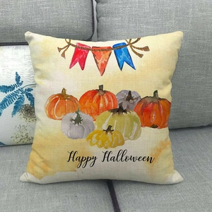 Detail of linen Halloween pillowcase with colorful pumpkins and Happy Halloween text