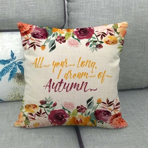 Detail of linen pillowcase with floral prints and I dream of Autumn script text