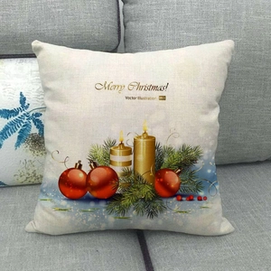 Linen Christmas pillow case with festive candles and Merry Christmas text on sofa