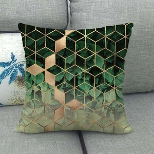 Linen cushion cover featuring green leaf patterns and 3D golden geometric lines