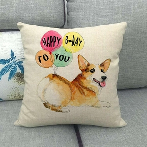 Funda de cojín de lino corgi con globos de cumpleaños coloridos sobre un sofá gris