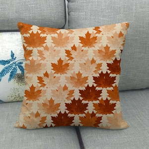 Detail of colorful autumn maple leaf patterns on a linen blend throw pillow cover