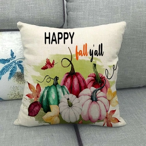 Fall watercolor pumpkins linen pillowcase with Happy Fall Y'all text on sofa
