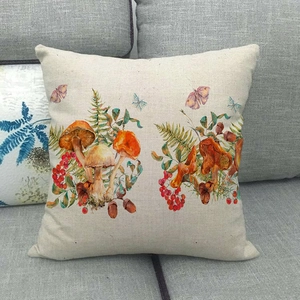 Detailed view of autumn mushroom and fern print on beige linen throw pillow case