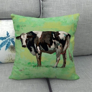 Artistic cow oil painting linen pillow cover displayed on a modern grey fabric sofa
