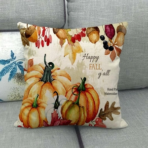 Close-up of watercolor pumpkin and maple leaf print on linen pillowcase with text