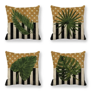 Detailed macro view of linen texture and tropical leaf patterns on square pillowcases