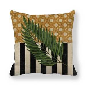 Detailed texture of linen cushion cover with green palm leaf and geometric patterns
