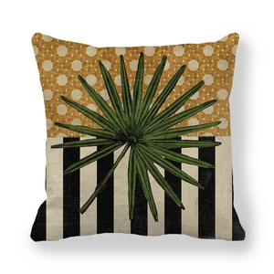 Detail of linen pillow cover featuring tropical palm leaf and geometric woven pattern