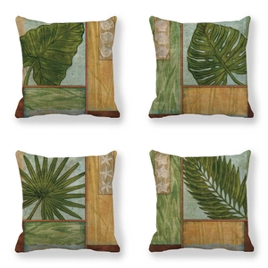 Set of four linen cushion covers with tropical leaves and starfish in vintage forest green