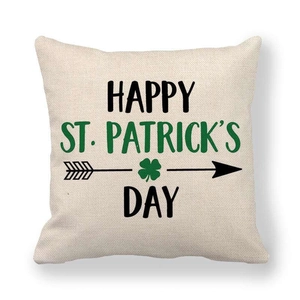 Macro shot of St. Patrick's Day linen pillowcase with green text and clover motifs