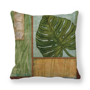 Retro linen throw pillow cover featuring a large green monstera leaf and shell details