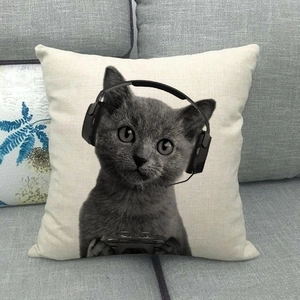 Detailed texture of linen cat pillowcase with a kitten wearing gaming headphones