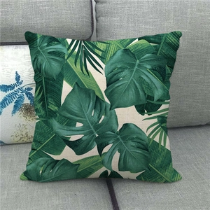 Close-up of Monstera leaf print on natural linen pillowcase texture for grey sofas