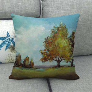 Linen pillow cover with oil painting style autumn landscape on a grey sofa
