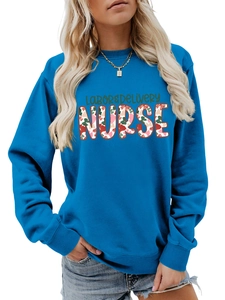 Detail of Labor & Delivery Nurse floral lettering on cobalt blue crewneck sweatshirt