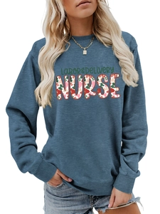 Close-up detail of soft blue Labor & Delivery Nurse sweatshirt fabric and floral print