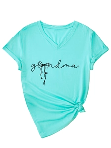 Close-up of grandma text print and stylish side-knot hem on light blue V-neck T-shirt