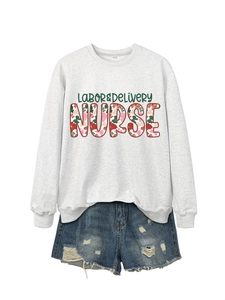 Flat lay of a grey Labor & Delivery Nurse sweatshirt with distressed denim shorts