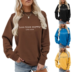 Detail showing various colors and 'love them anyway' print on crewneck sweatshirts