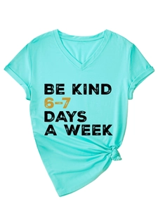 Detail of V-neck mint t-shirt with rolled sleeves and front hem knot featuring Be Kind print