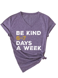 Detail of V-neck heather purple T-shirt with BE KIND print and front knot hem design