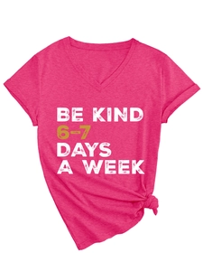 Detail of V-neck T-shirt in fuchsia featuring Be Kind 6-7 Days slogan and front knot design