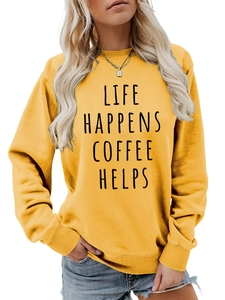 Detail of crew neck sweatshirt in mustard yellow with Life Happens Coffee Helps text