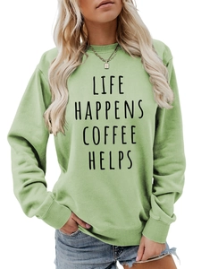 Detail of light green sweatshirt cuff with Life Happens Coffee Helps print