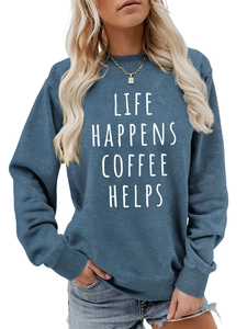 Detailed view of the blue crewneck sweatshirt with 'Life Happens Coffee Helps' print