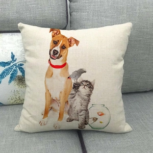 Linen cushion cover detail with cat, dog, and parrot print on a gray sofa