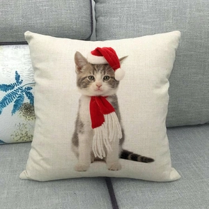 Detailed texture of linen pillowcase featuring a cute gray cat in a Christmas hat