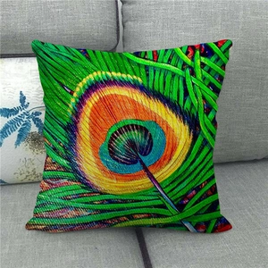 Detailed texture of peacock feather pattern linen pillow cover on a grey sofa