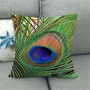 Detailed peacock feather pattern on a linen throw pillowcase placed on a sofa