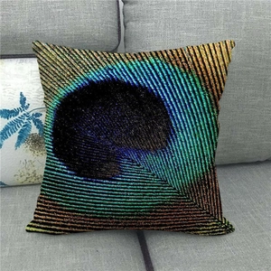 Detail view of linen peacock feather pillowcase on a sofa showing fabric texture