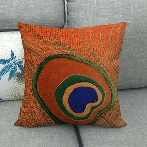 Close-up of linen cushion cover featuring vibrant retro peacock feather pattern on sofa