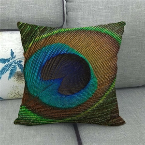Detailed view of peacock feather eye pattern on textured linen decorative pillowcase