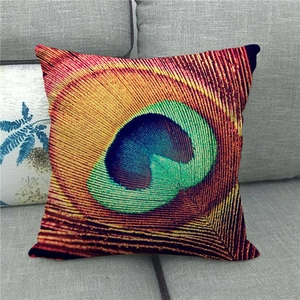 Detailed close-up of peacock feather eye pattern on linen throw pillow cushion cover