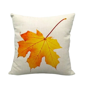 Linen thanksgiving pillow cover featuring a large orange autumn maple leaf on beige fabric