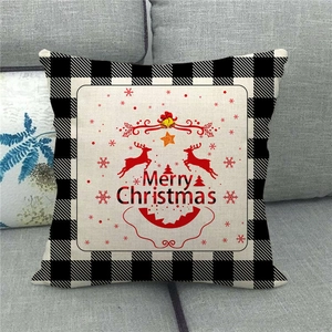 Close-up of Merry Christmas linen pillowcase with red reindeer and buffalo plaid borders