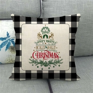Detail of Christmas buffalo plaid linen pillowcase featuring a festive tree design on a sofa